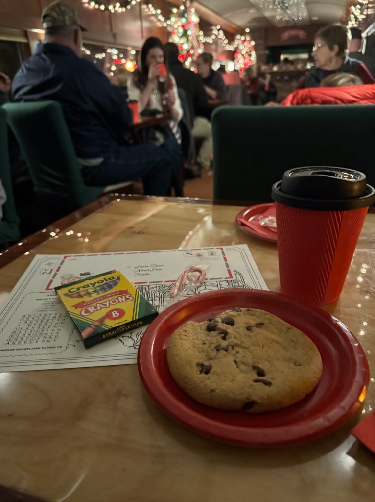 Hot cocoa, cookies, crayons, a candy cane, activity sheet, and pre-addressed envelope to Santa were given to passengers aboard Santa's Scenic Railway.